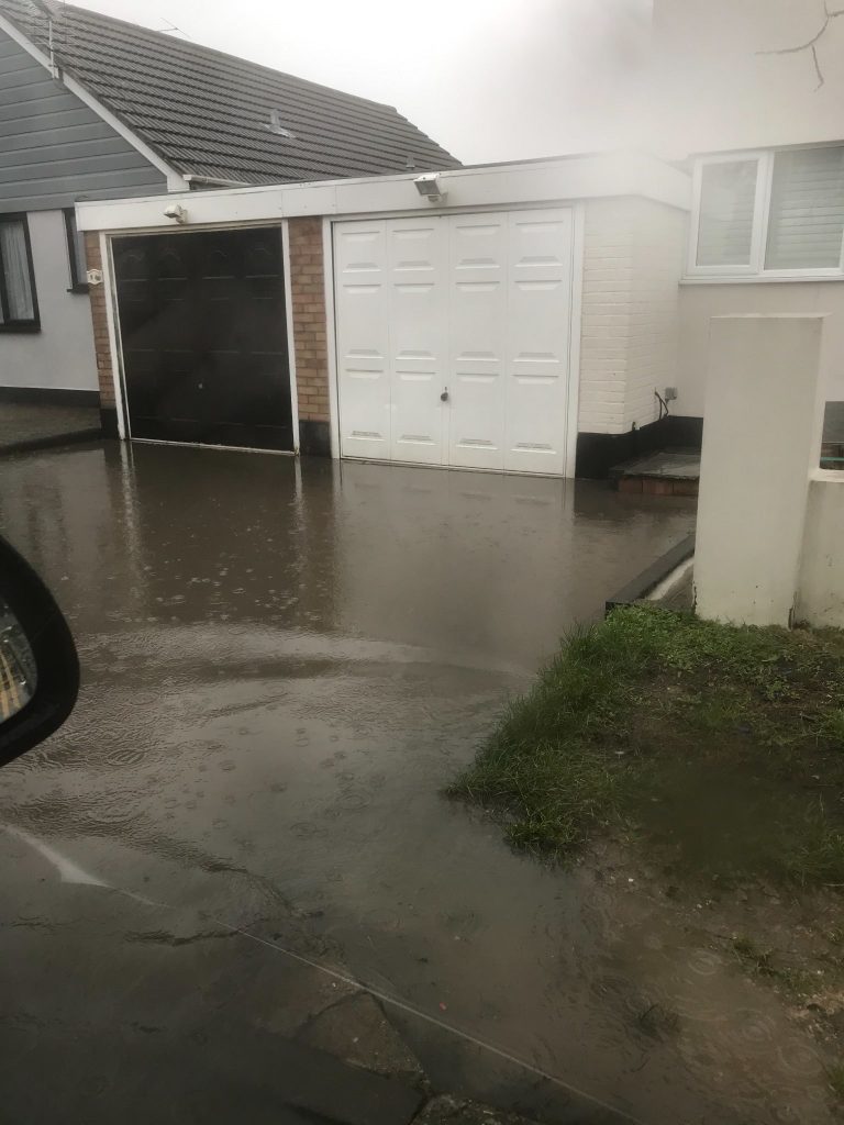 Drainage problems with flooded driveway