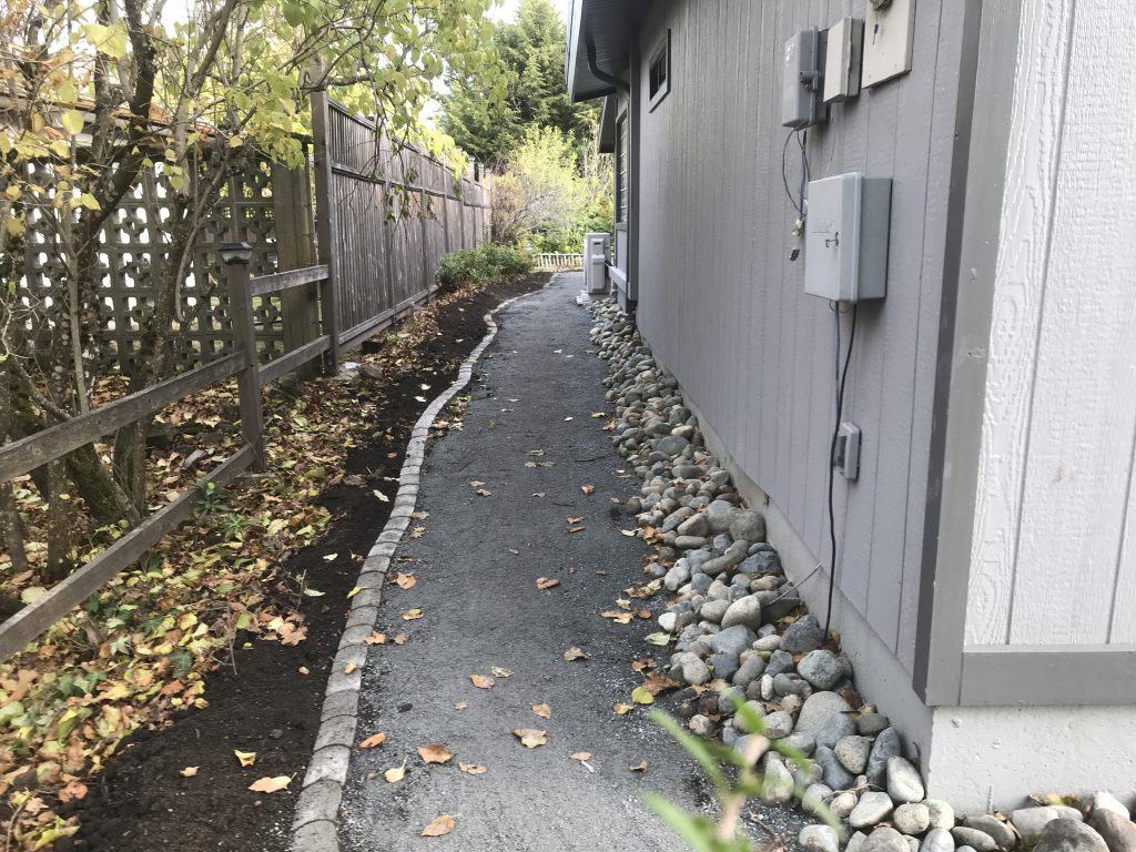 Curved Gravel Pathway with Edging and River Rock Side