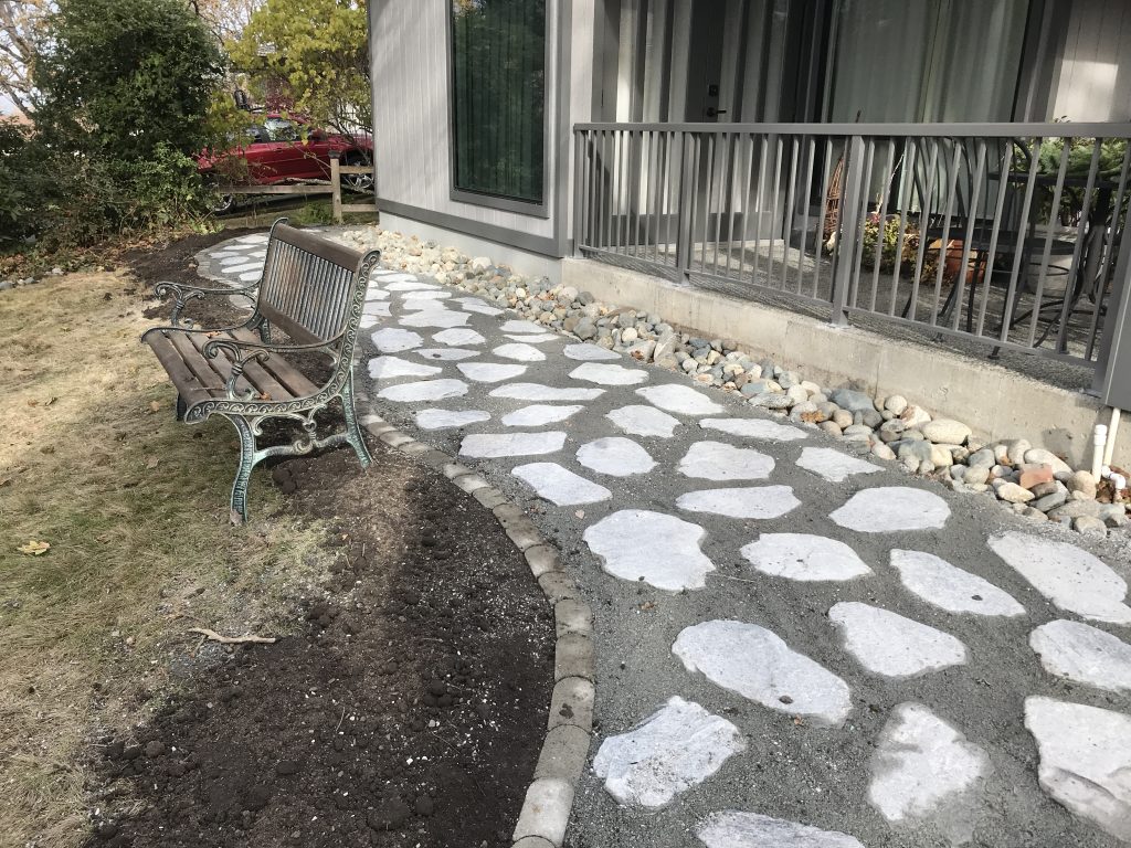 Flagstone Patio with Gravel Pathway and Drip Irrigation